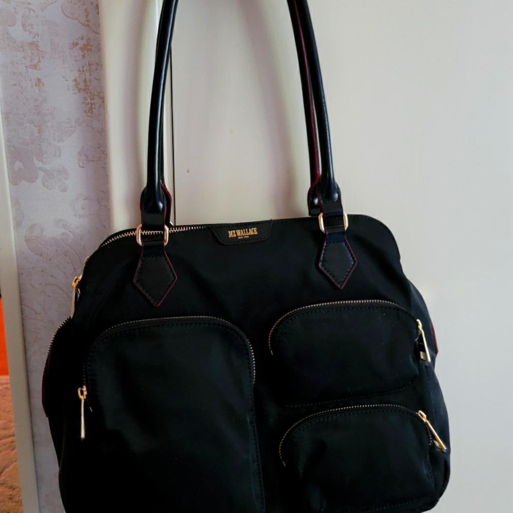 MZ Wallace black bag, deep zippered pockets both sides, multiple smaller pockets
